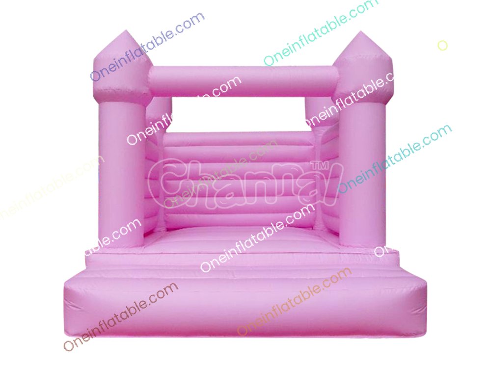 small pastel pink wedding bouncy castle